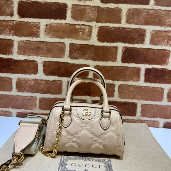 G*u*i gg matelassé leather top handle bag