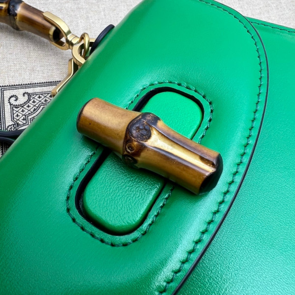 G*u*i mini top handle bag with bamboo