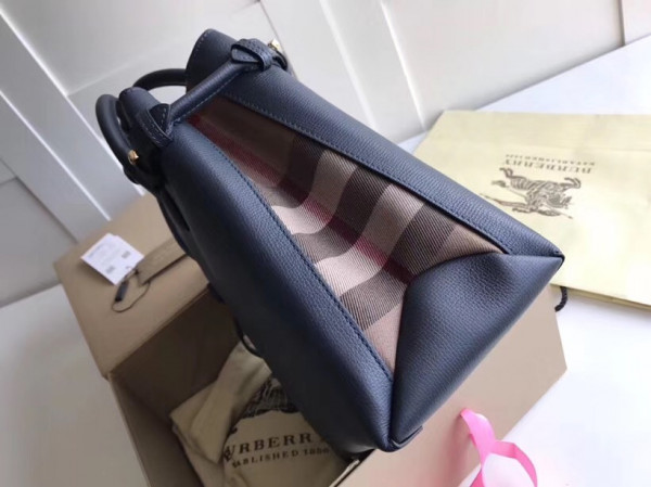 B**rry the medium banner in leather and house check